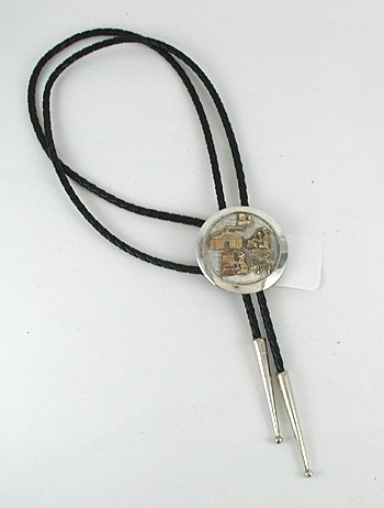 Navajo  gold storyteller  bolo tie