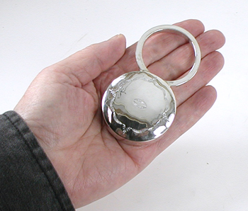 Authentic Native American handmade stamped sterling silver baby ring rattle by Navajo silversmith Jeffrey Castillo