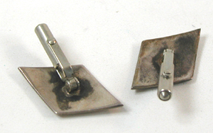 lot of three wooden button covers, key chain with bird, pair of Hopi-style cufflinks