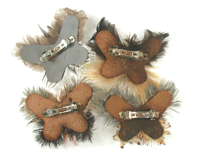 lot of four feather barrettes and one beaded headband