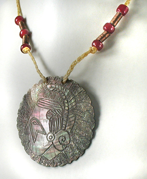 engraved shell pendant and cord necklace with beads by B. Radford