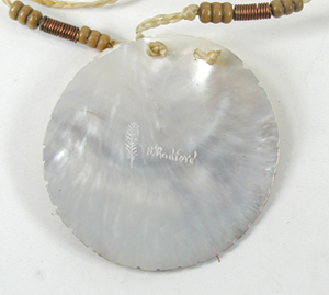 engraved shell pendant and cord necklace with beads by B. Radford
