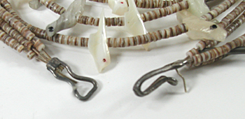 four strand bird necklace 29 inches long of mother of pearl and olive shell heishi