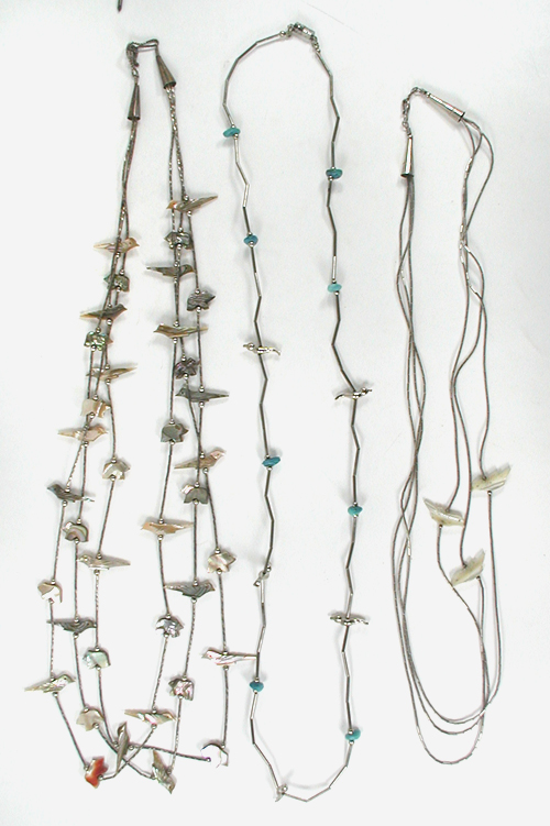 Three multi-strand necklaces with birds, olive shell heishi, melon shell heishi approximately 24 to 28 inches long