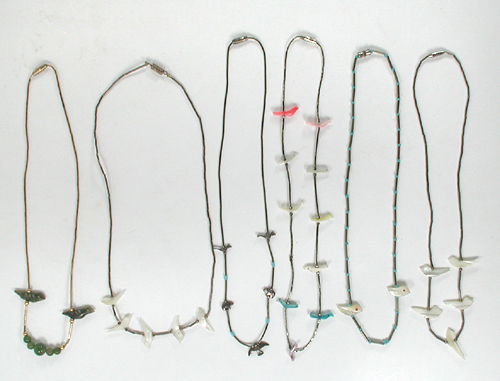 six single strand bird necklaces approximately 14 to 16 inches long