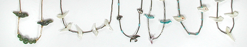 six single strand bird necklaces approximately 14 to 16 inches long