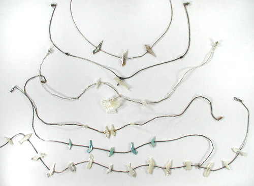 Six single strand Bird Necklaces approximately 14 to 24 inches long