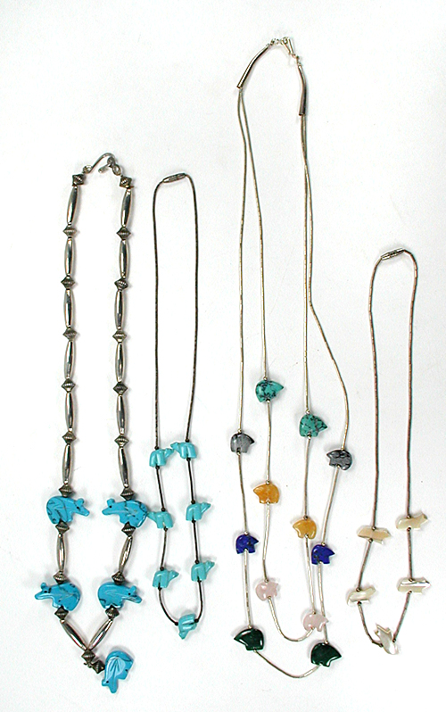 Four Bear and Fish Necklaces approximately 22 to 28 inches long
