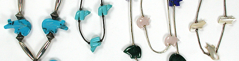 Four single strand Bear and Fish Necklaces approximately 22 to 28 inches long