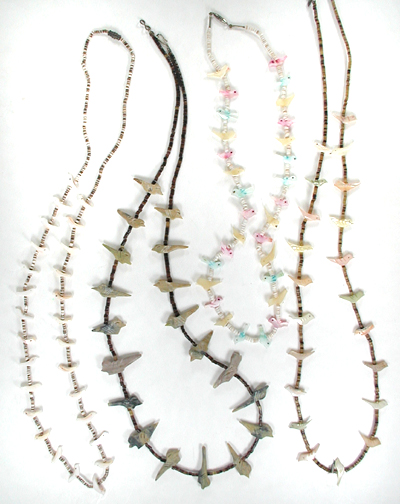 Four single strand bird necklaces approximately 16 inches long