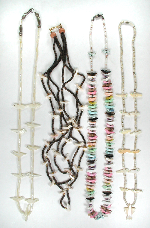 Four single strand bird necklaces approximately 16 inches long