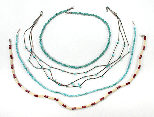 lot of four single-strand necklaces