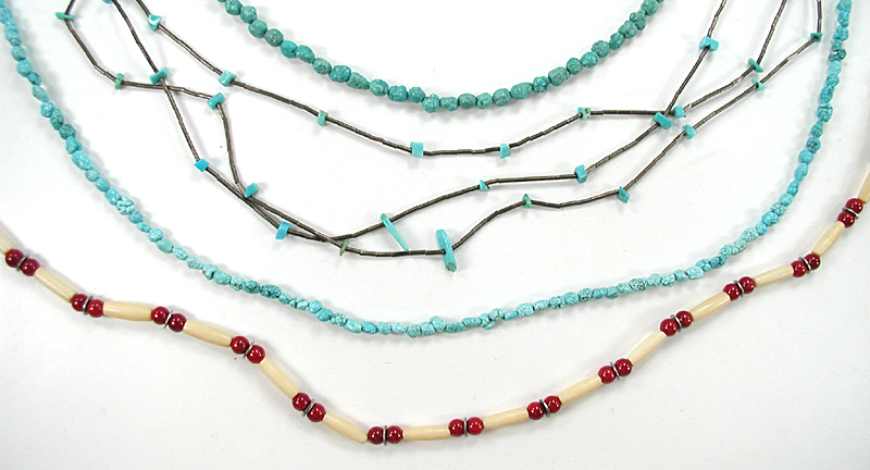 lot of four single-strand necklaces