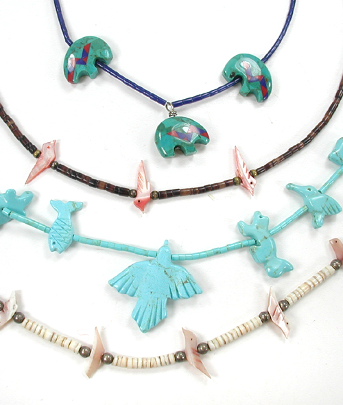Six single strand bird necklaces approximately 16 inches long