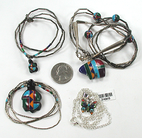 lot of four single-strand inlay animal necklaces