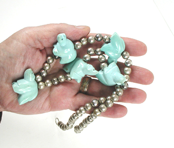 silver bead necklace 21 inches long with 5 turquoise  bears