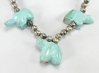 silver bead necklace 21 inches long with 5 turquoise  bears