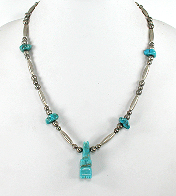 silver bead necklace 22 inches long with turquoise nuggets and bear