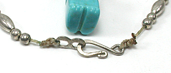 silver bead necklace 22 inches long with turquoise nuggets and bear