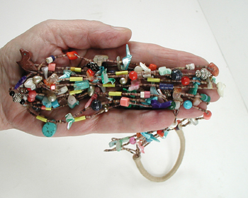 Seven strand treasure necklace 26 inches long with faux squaw wrap