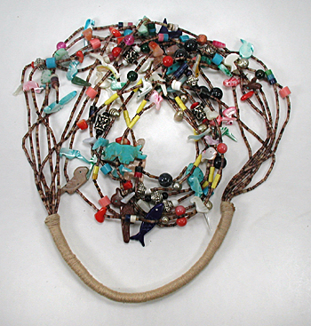 Seven strand treasure necklace 26 inches long with faux squaw wrap
