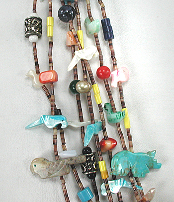 Seven strand treasure necklace 26 inches long with faux squaw wrap