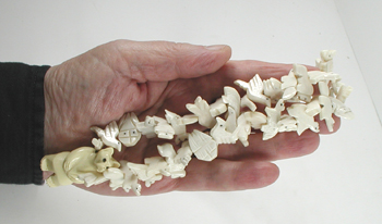 Stacked Animals necklace of bone with faux squaw wrap 30 inches long