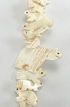 Stacked Animals necklace of bone with faux squaw wrap 30 inches long