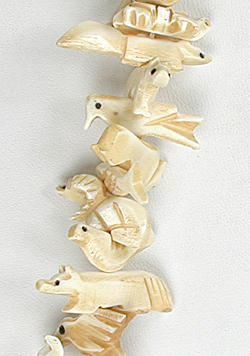 Stacked bone animals necklace 32 inches long with matching earrings