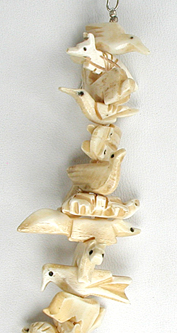 Stacked bone animals necklace 32 inches long with matching earrings