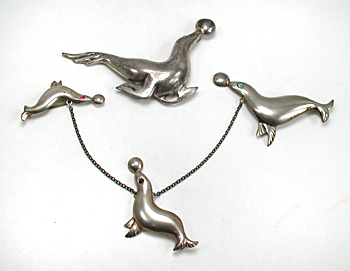 four sterling silver seal pins
