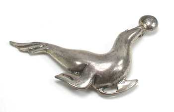 four sterling silver seal pins