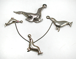 four sterling silver seal pins