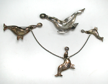 four sterling silver seal pins