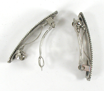 one pair stamped sterling silver Bison barrettes