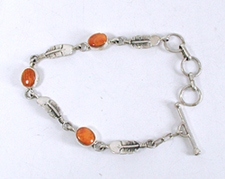 New Old Stock Inlay bracelet Sterling Silver and orange and purple spiny oyster link bracelet by Navajo artist Teddy Goodluck, Jr.