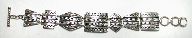 stamped sterling silver link bracelet by Kewa silversmith Raymond Coriz