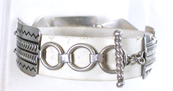 stamped sterling silver link bracelet by Kewa silversmith Raymond Coriz