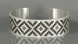 Authentic Native American Sterling Silver rug pattern cuff bracelet by Navajo silversmith Roland H. Begay