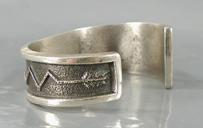 Authentic Native American handmade tufa cast sterling silver and coral inlay bracelet by Navajo silversmith Aaron Anderson size 6 1/4