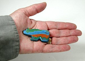 Authentic Zuni Bear Fetish carved from Rainbow Calsilica by Bernard Laiwakete - in hand