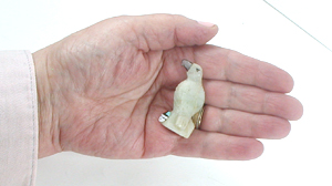 Zuni Eagle fetish of white Marble with inlaid sunface by Darrin Boone