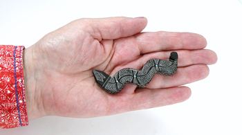 Authentic Native American Snake Fetish Carving of black marble with inlaid turquoise eyes by Zuni carver Patrick Wallace