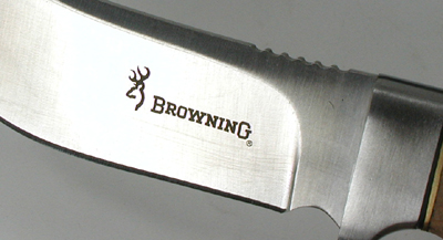 Close view of Browning fixed blade knife with sterling silver eagle head inlay in grip