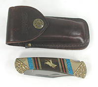 Buck Custom folding knife with bull rider inlay by Navajo David Yellowhorse