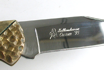 Buck Custom folding knife with bull rider inlay by Navajo David Yellowhorse