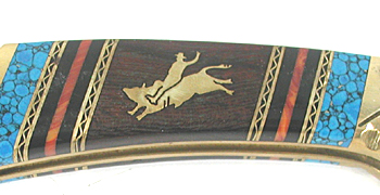 Buck Custom folding knife with bull rider inlay by Navajo David Yellowhorse