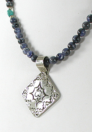 lapis bead necklace with stamped sterling silver pendant by Navajo artisans Charlene and Robert Little 20 inches long 