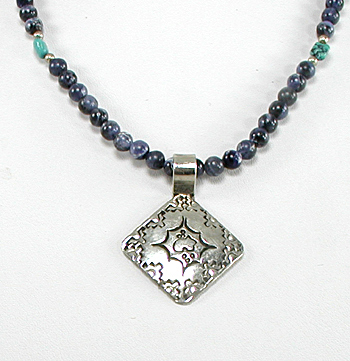 lapis bead necklace with stamped sterling silver pendant by Navajo artisans Charlene and Robert Little 20 inches long 