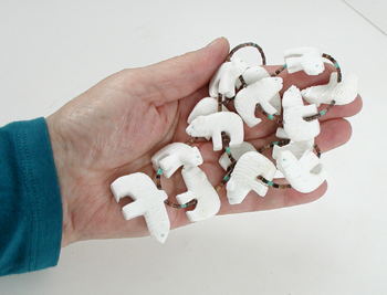 31 inch necklace with olive shell heishi and 15 white alabaster bears